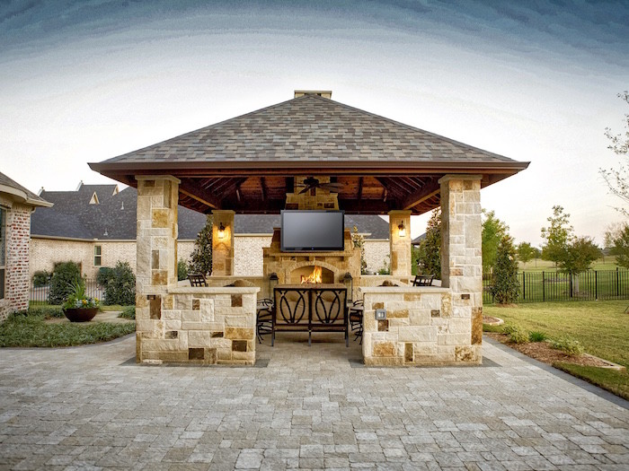 Covered outdoor shop kitchen with fireplace